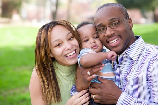 Tips Help Bring Out Best Parents. Photo of a diverse family with small toddler; courtesy of iStock.