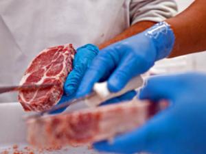 NIFA Impact-Meat Processing. Image of meatpacking worker, courtesy of iStock Photo.