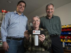 Photo featuring Chris Callahan (left) and the "DewRight" invention courtesy of University of Vermont Extension.
