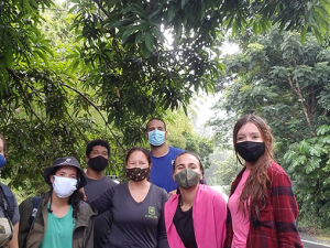 PRNCT participants wearing face masks with trees in the background. Photo by UPR staff.
