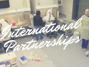 This image is a screenshot from Kansas State University's Partnership Video that links to the YouTube video. The image includes text over top the image that reads International Partnerships.